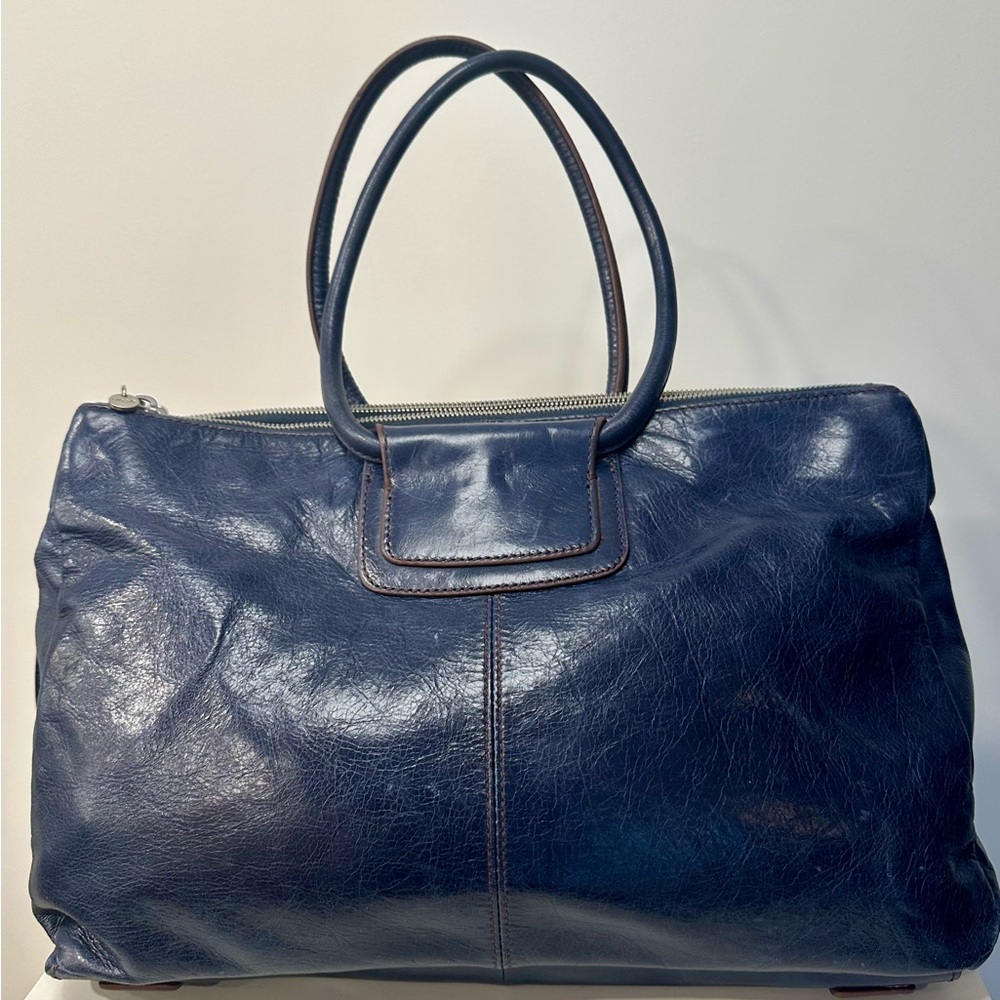 Hobo Salina in blue stone. Some wear at corners & zipper. Interior perfect.